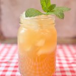 brown sugar lemonade in a pint size mason jar with a sprig of mint