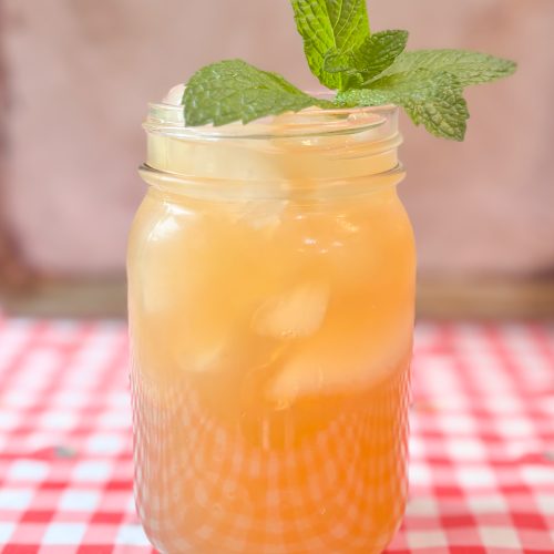 brown sugar lemonade in a pint size mason jar with a sprig of mint