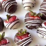 Strawberries dipped in white and dark chocolate