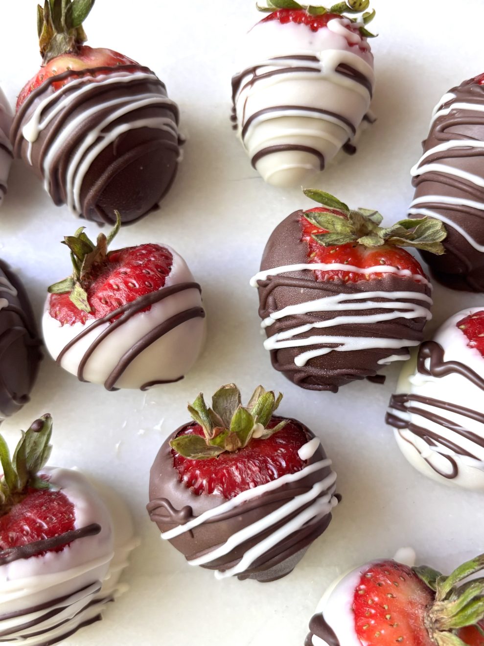 Strawberries dipped in white and dark chocolate