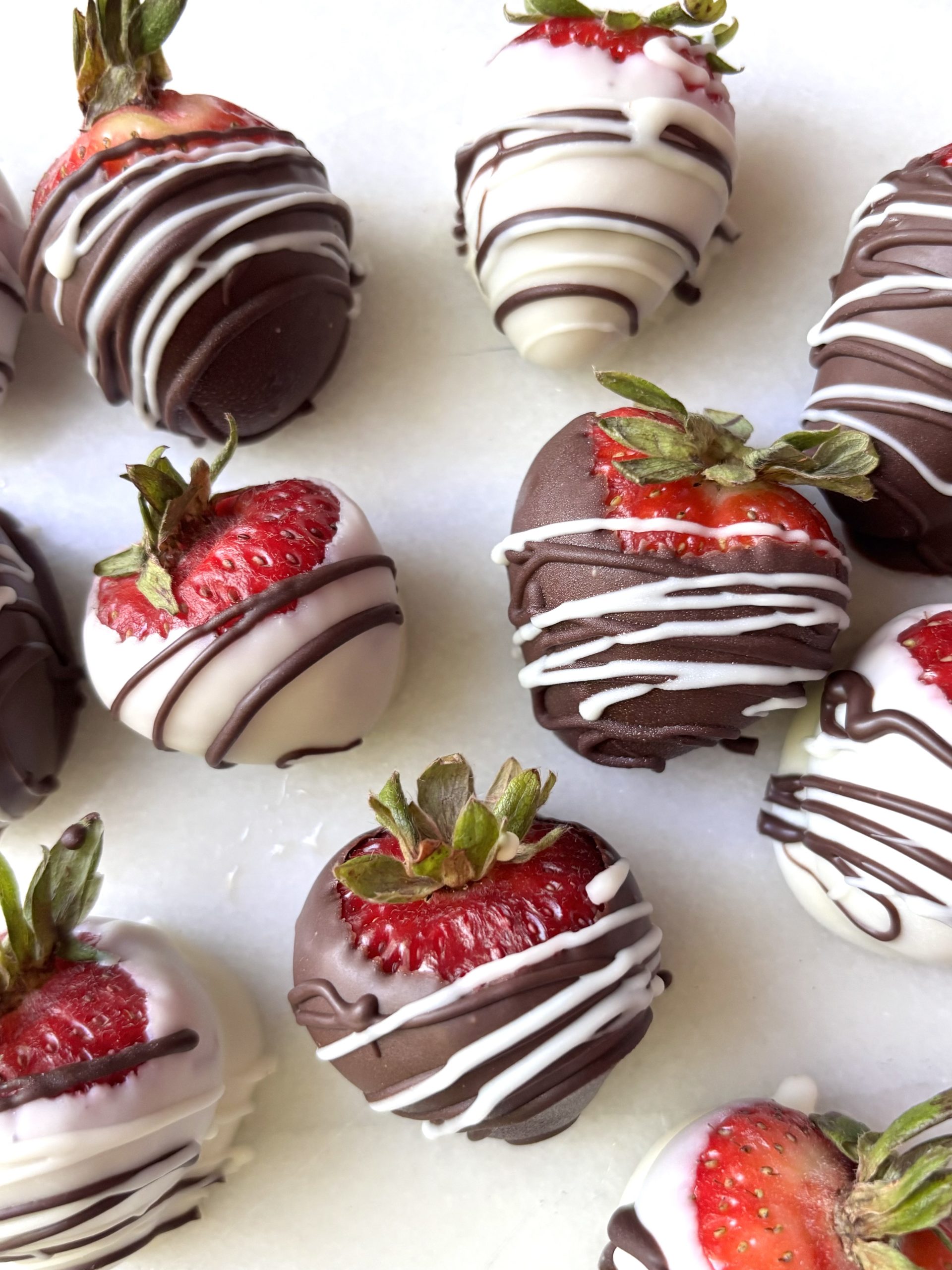 Strawberries dipped in white and dark chocolate